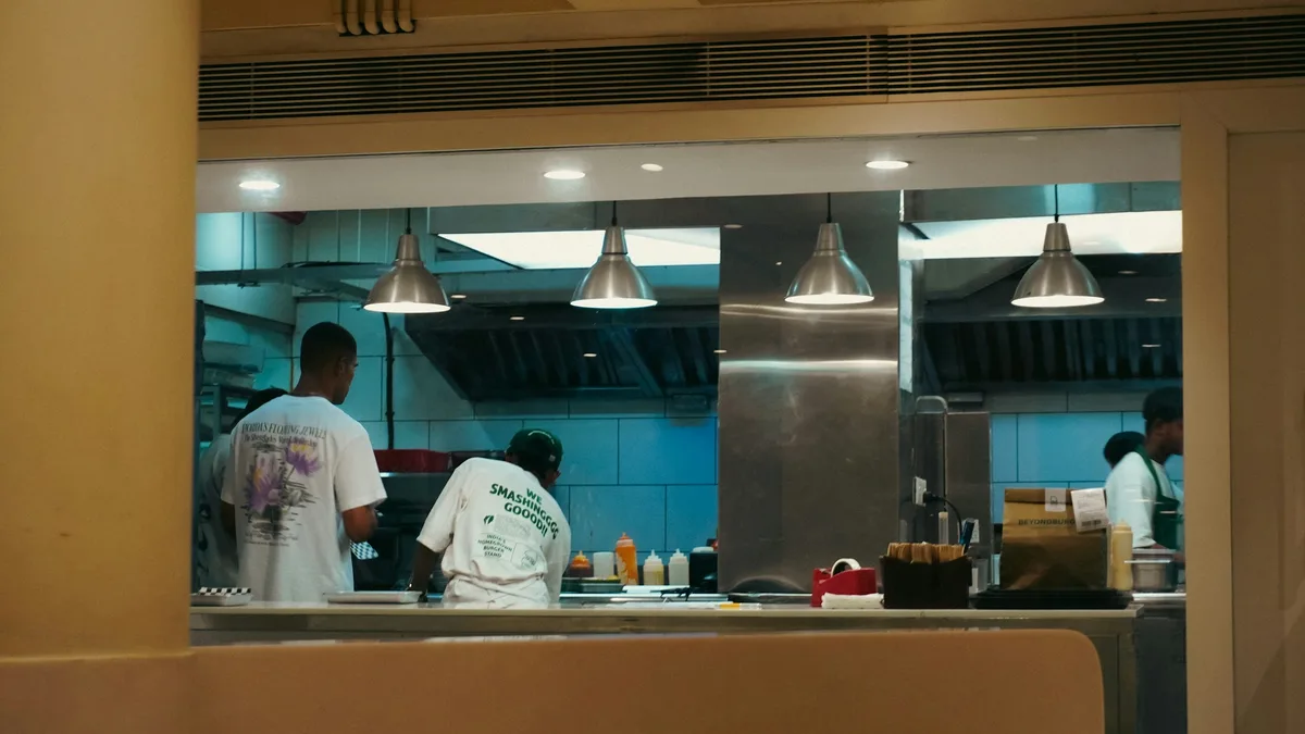 Canadian restaurant team reviewing a weekly schedule before service
