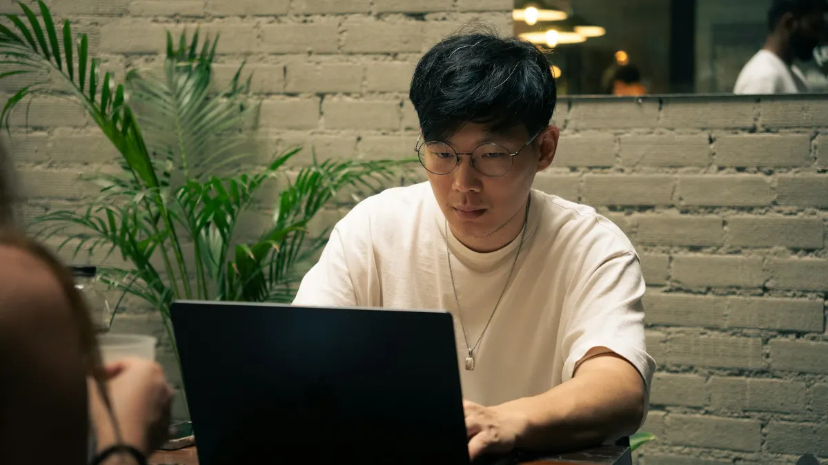 Restaurant manager reviewing a weekly schedule before service