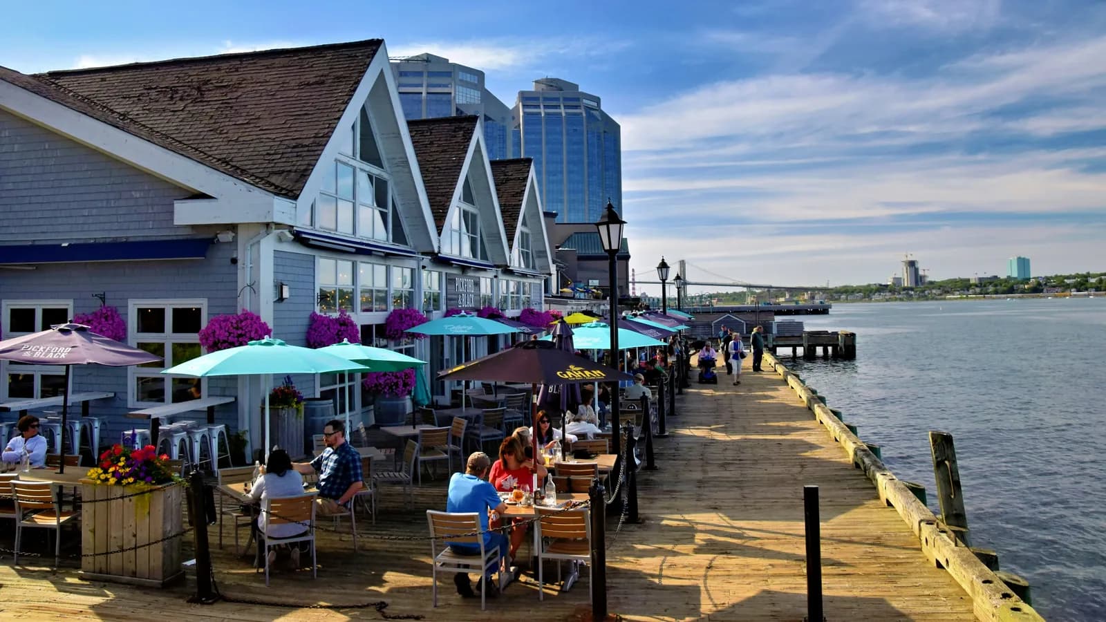 People dining on the Halifax waterfront boardwalk