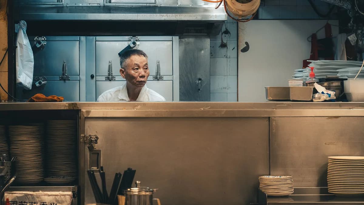 Ontario restaurant kitchen worker reviewing shift coverage before service