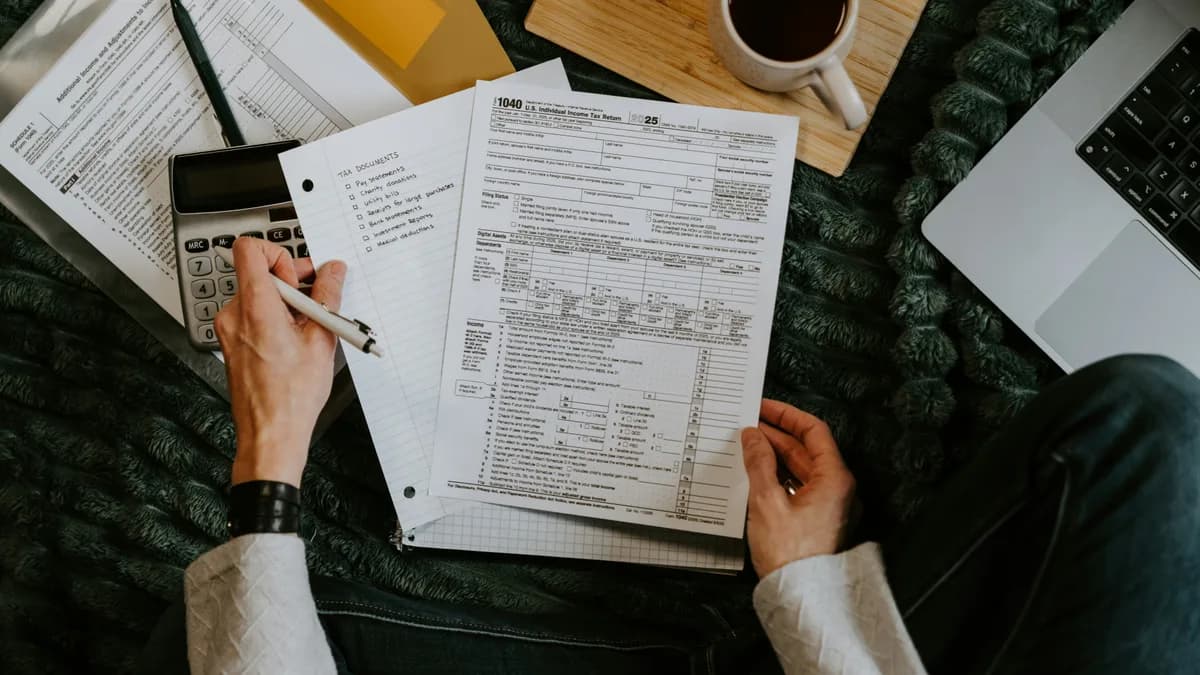 Restaurant manager reviewing receipts and labour numbers beside a schedule
